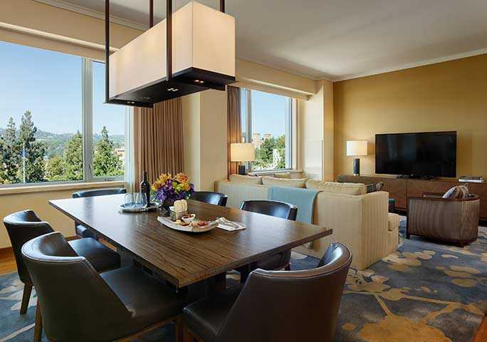 Presidential Suite - a living room with comfortable seating and stunning views of the UCLA campus