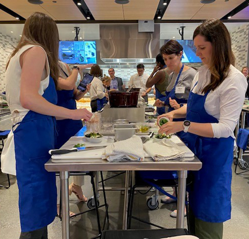 Conference goes prepare dishes in UCLA's new teaching kitchen